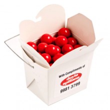 WHITE CARDBOARD NOODLE BOX FILLED WITH ORANGE CHOC DROPS (JAFFA LOOK ALIKE) 100G